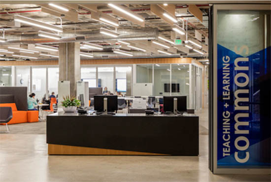 Entry and sign for UC San Diego's Teaching + Learning Commons located inside Geisel Library