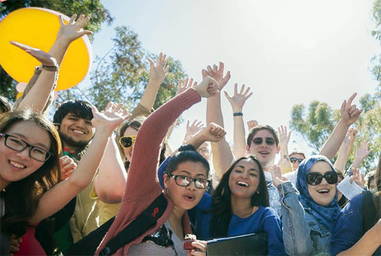 Group of international students cheer on campus at UC San Diego