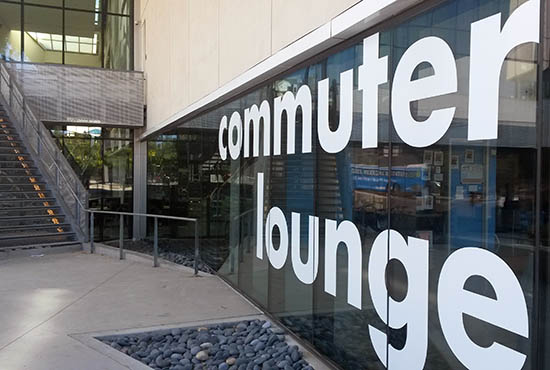 Exterior glass entry with sign - UC San Diego's Commuter Lounge in Price Center East