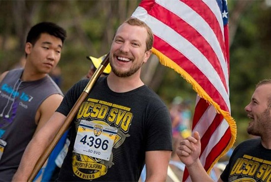 Student veterans carry a U.S. flag on campus at UC San Diego